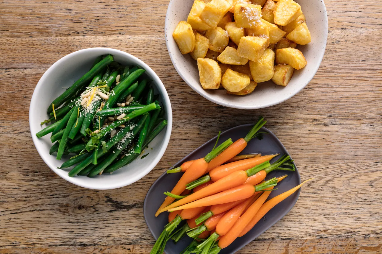Roast potatoes, baby carrots and beans