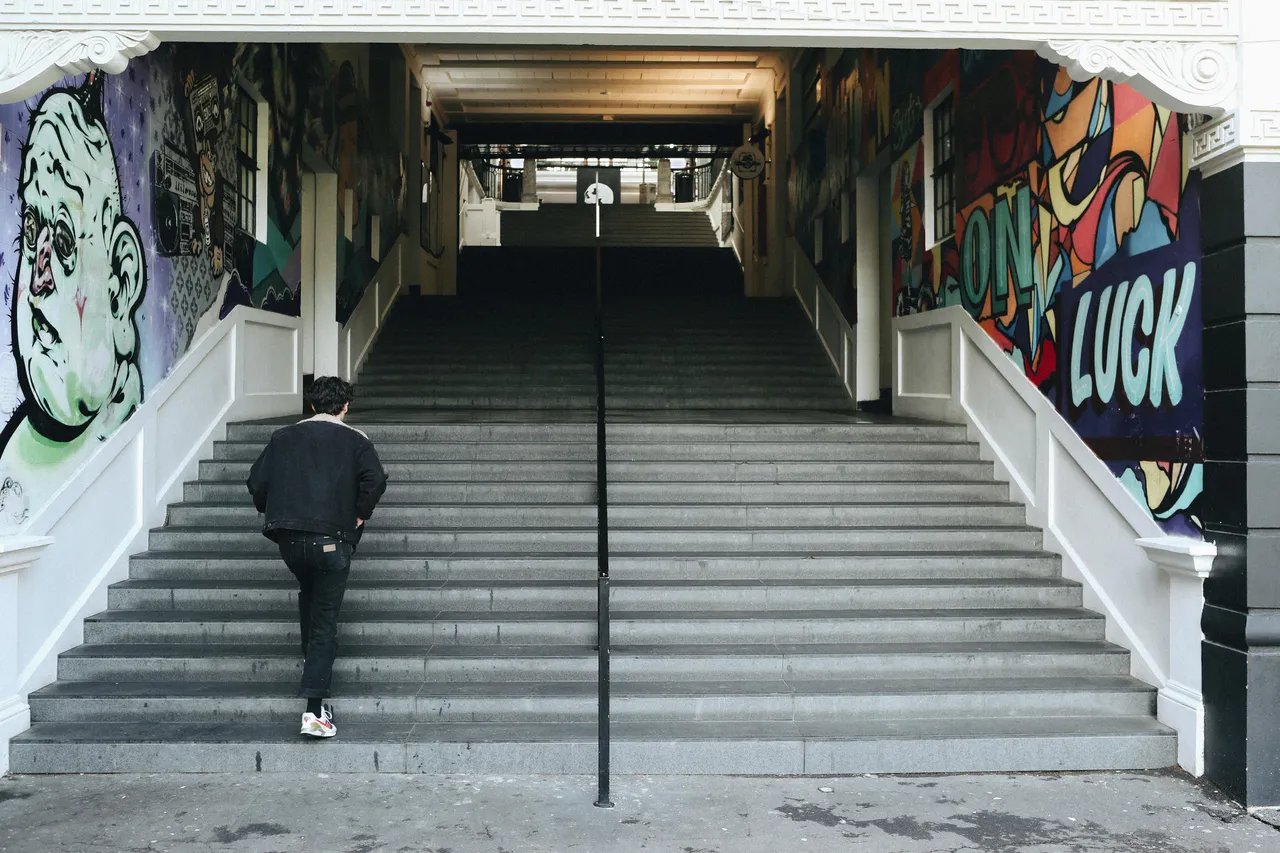 Man walking up stairs