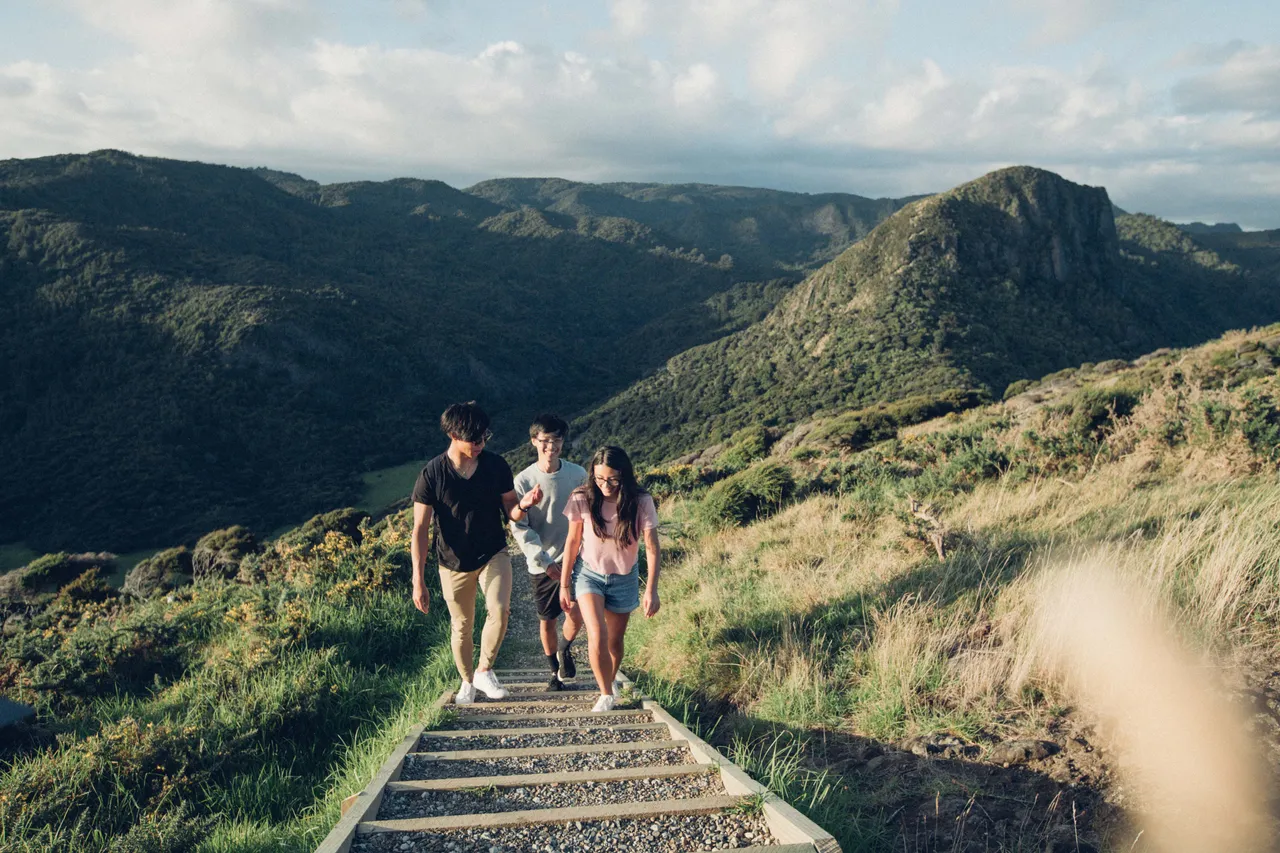 Group interacting while walking on nature track