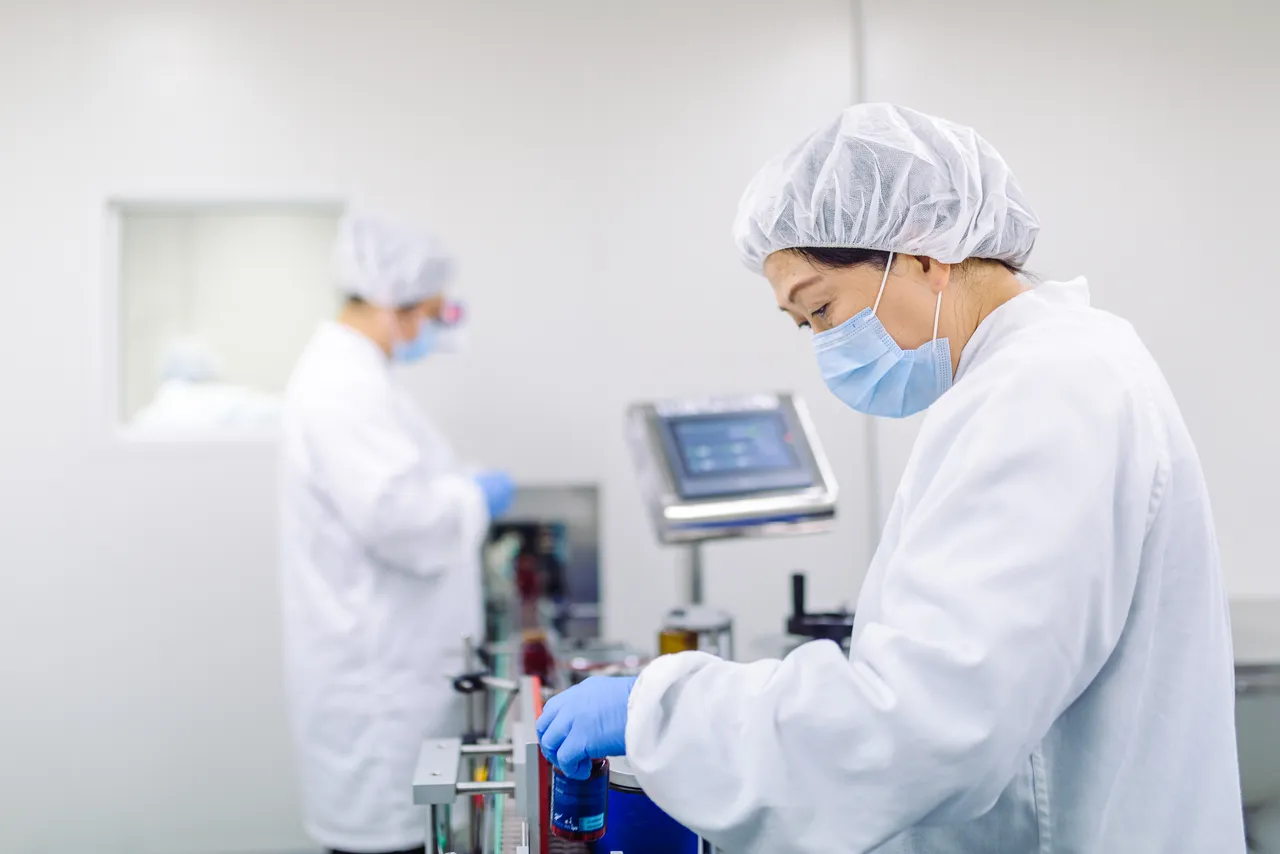 Woman with mask in processing room